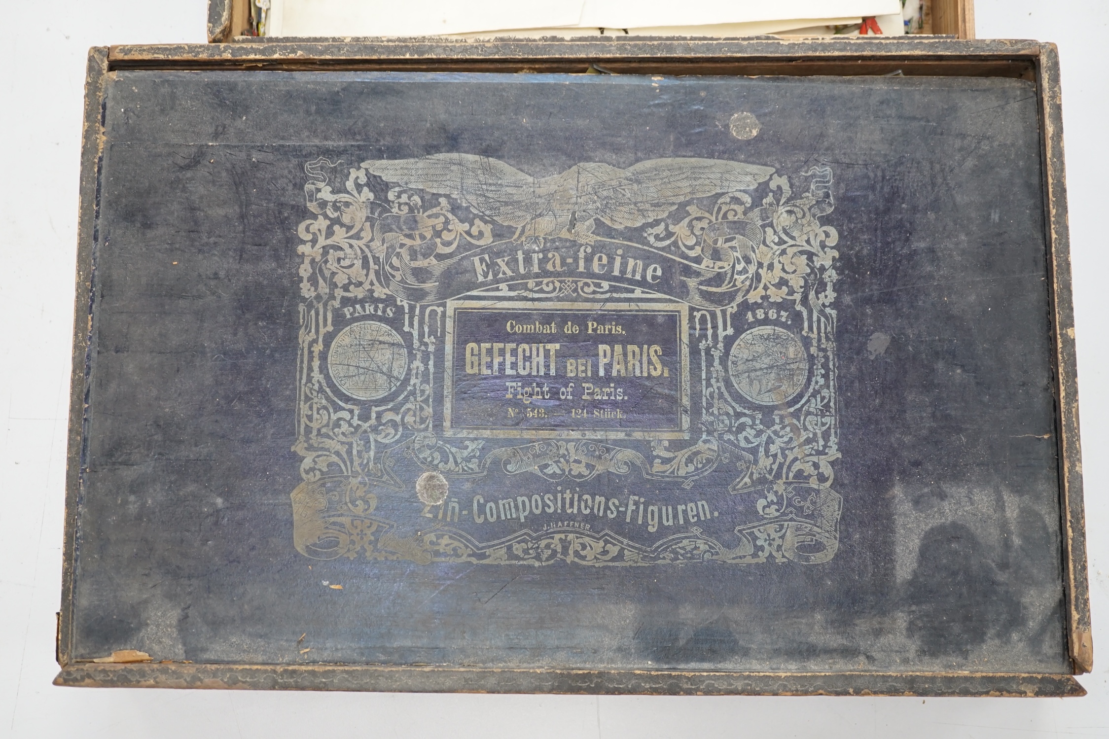Two late nineteenth century wooden Haffner boxes of flat/semi-flat soldiers, contents believed to be primarily by Haffner; ‘Fight of Paris’ (set no.543) and ‘Battle of Sedan’ (set no.528)